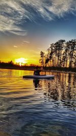 Scenic view of lake at sunset