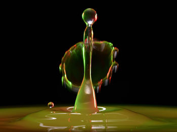 Close-up of green table against black background