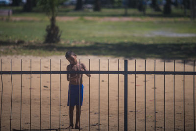 Full length of boy standing on land