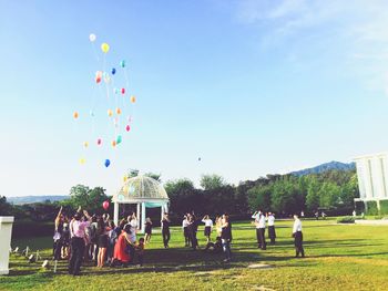 People on grassy field