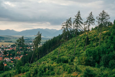 Scenic view of mountains against cloudy sky