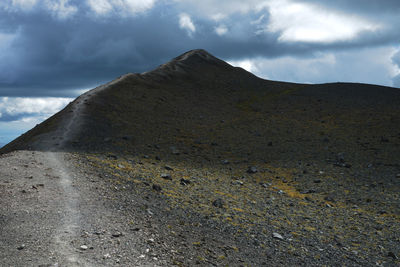 Scenic view of volcanic mountain against sky