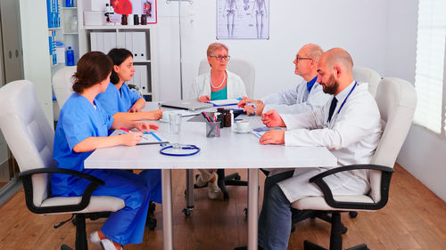 Midsection of doctor working at clinic