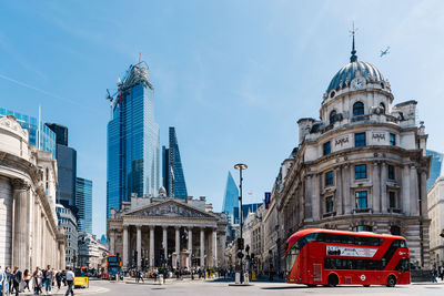 Panoramic view of city street and buildings against sky