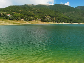 Scenic view of sea against mountain