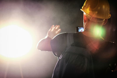 Silhouette of woman in dark room
