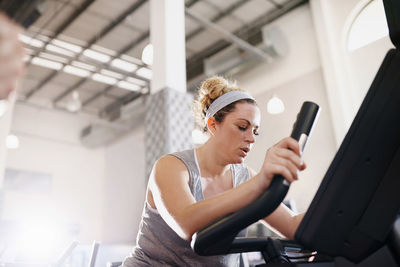 Mature woman exercising at gym