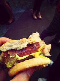 Cropped image of woman eating food