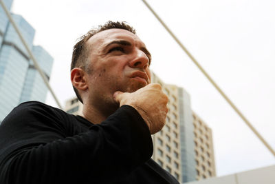 Portrait of young man looking away