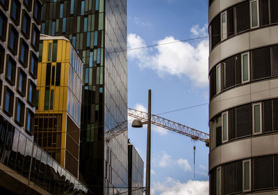 Low angle view of modern buildings against sky