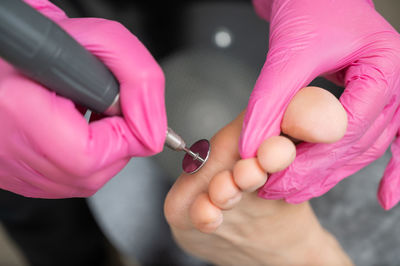 Cropped hand of man repairing car