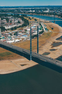 High angle view of buildings by sea against sky