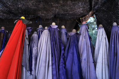 Group of people on multi colored umbrellas