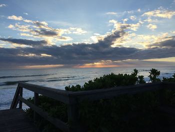 Scenic view of sea against sky at sunset