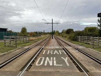 Railroad tracks against sky