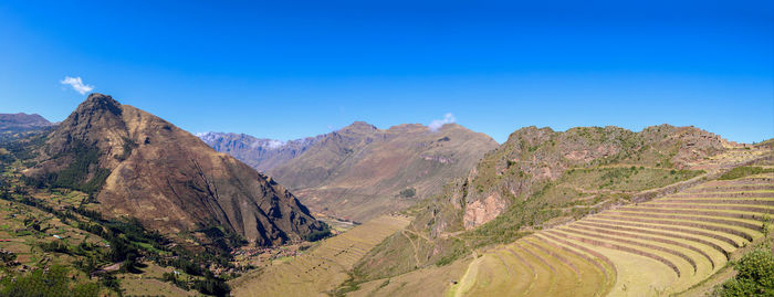 Scenic view of mountains against clear blue sky