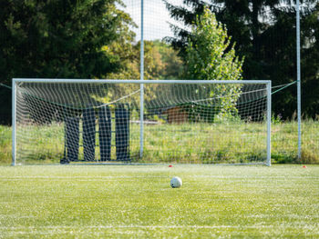 Selective focus. ball is prepared for penalty kick. gate is out of focus.