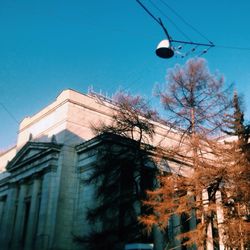 Low angle view of buildings against blue sky