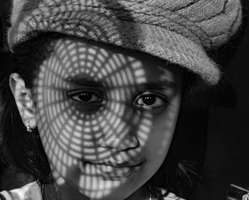 Close-up of woman wearing hat