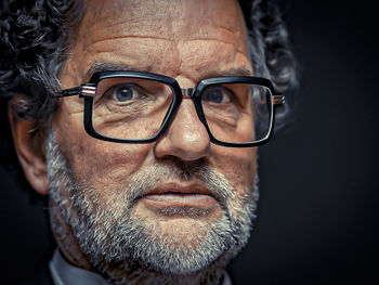 Close-up portrait of man wearing eyeglasses