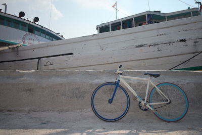 Bicycle parked against sky