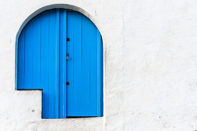 Blue closed door of building