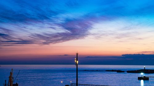 Scenic view of sea against sky at sunset