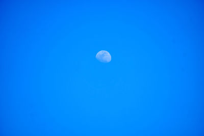 Low angle view of moon against clear sky