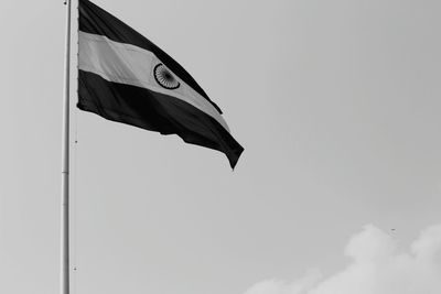 Low angle view of flag against clear sky