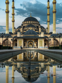 Reflection of mosque in city
