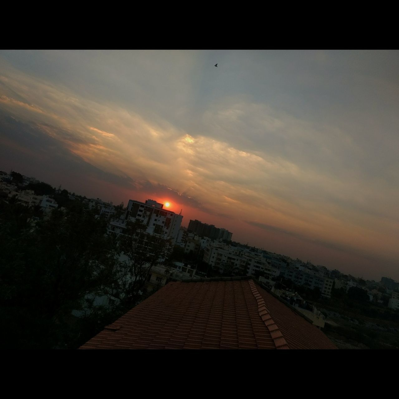 VIEW OF CITY AGAINST SKY DURING SUNSET