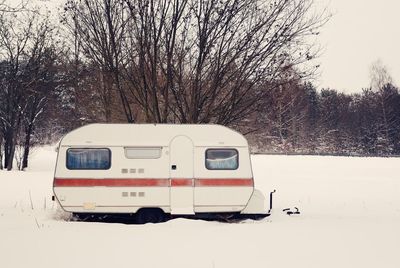 Travel trailer on snow covered field