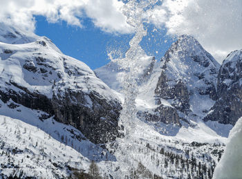 Snow covered mountains against sky