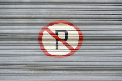 Close-up of warning sign on shutter