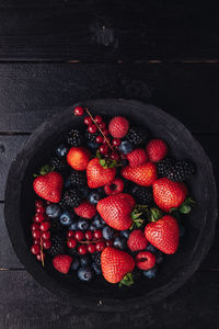 High angle view of strawberries in bowl on table