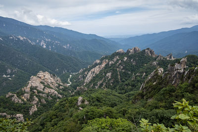 High angle view of trees and mountains against sky