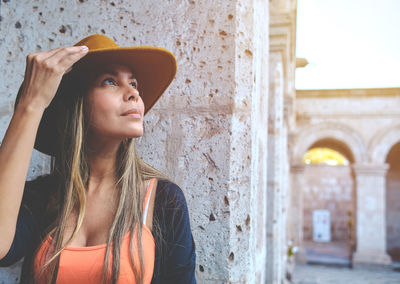 Side view of young woman looking away