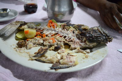 Close-up of half eaten served food on plate