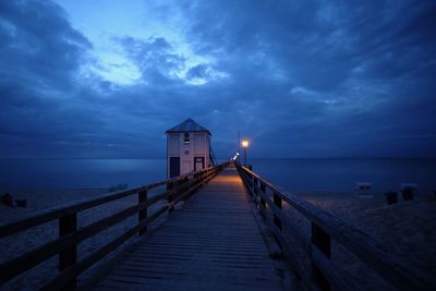 Pier over sea against sky