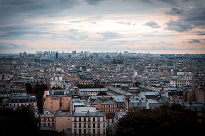 Cityscape against sky during sunset