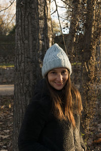 Close-up portrait of young woman wearing hat