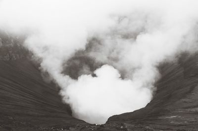 Smoke emitting from volcanic mountain