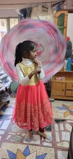 Girl standing with umbrella