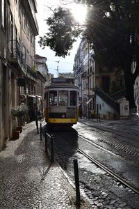 Old tram on a narrow street in portugal