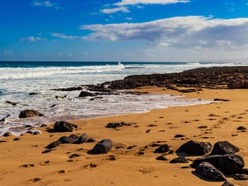 Scenic view of beach against sky