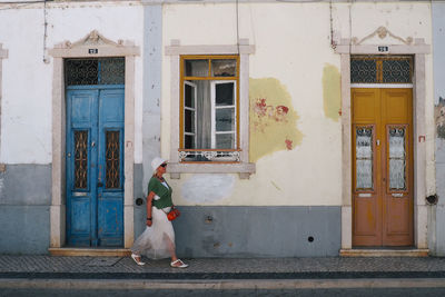 Woman on window of building