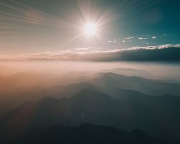 Scenic view of mountains against sky during sunset