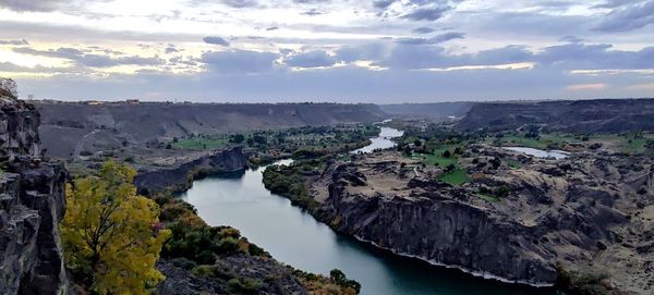 Panoramic view of river and mountains against sky