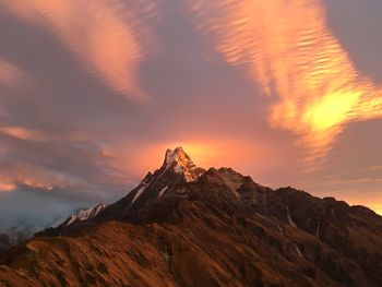 Scenic view of mountains against sky at sunset