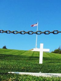 Barbed wire against blue sky